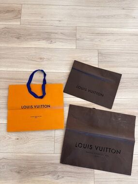Louis Vuitton Orange Gift Bag with Blue Ribbon Handles and Brown Paper Bags